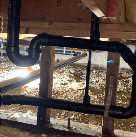 g2-j4q50g a basement area with a wooden floor and a metal pipe system